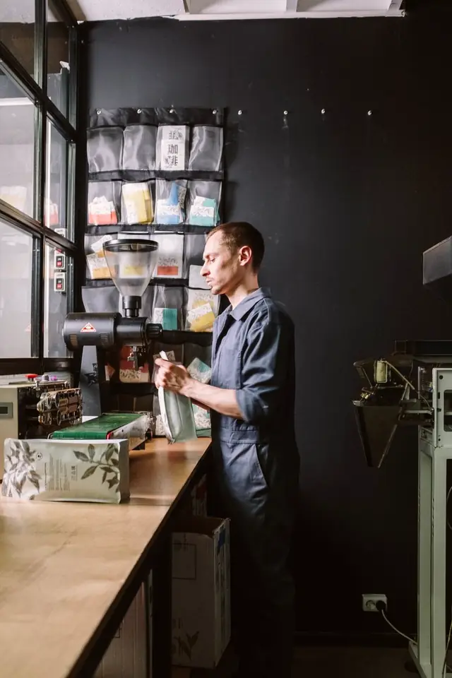 The roastery workspace with a grinder on the bench