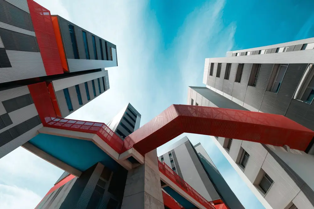 Two towers linked by red bridges, the report cover image